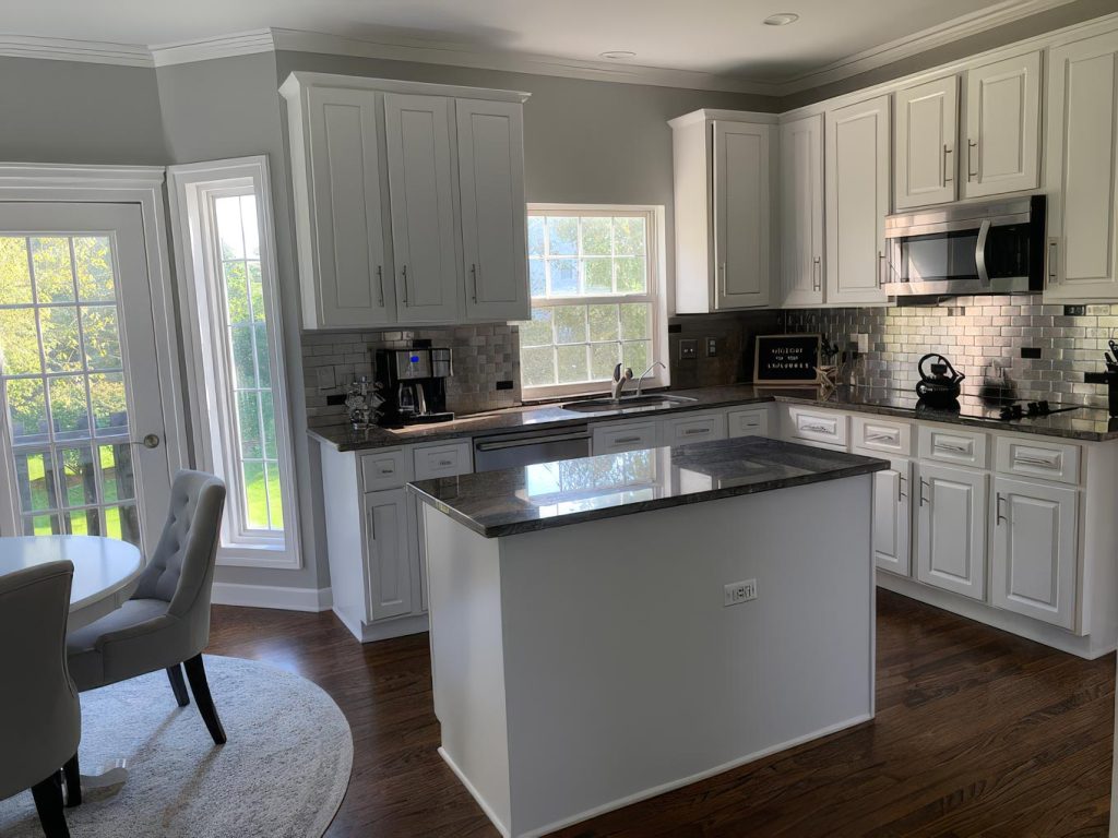 White kitchen cabinetry and painted interior from the Gutierrez painting gallery